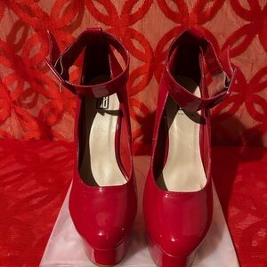 Red six inch pumps